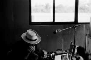 Photo of Carlos Grasso of Dumfuxx playing harmonica.