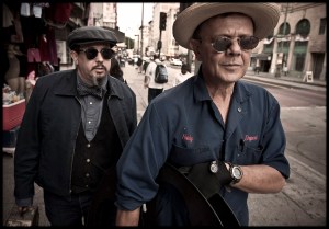 Photo of Carlos Grasso and James Slay strolling down a sidewalk